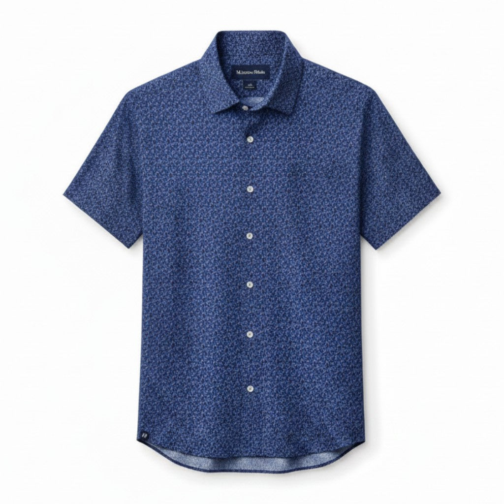 Mac & Clay Halyard Short Sleeve shirt in midnight navy with a variegated leaf print. Lightweight, moisture-wicking polyester-spandex blend.